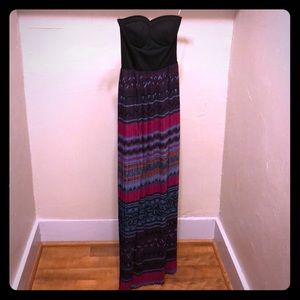 A floor length strapless party dress.